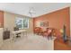 Large bonus room with ceiling fan features a desk and comfortable seating at 11492 Dancing River Dr, Venice, FL 34292