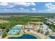Resort-style community amenities featuring tennis courts, swimming pools, and lush green spaces at 11492 Dancing River Dr, Venice, FL 34292