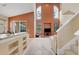Open-concept living room with soaring ceilings, large arched windows, and bright natural light at 11492 Dancing River Dr, Venice, FL 34292