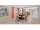 Dining room showcases a modern table with seating for four, adjacent to the kitchen at 20 Whispering Sands Dr # 501, Sarasota, FL 34242