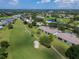 Beautiful aerial view of condos situated on a golf course with lakes, lush landscaping and mature trees at 6904 Drewrys Blf # 803, Bradenton, FL 34203
