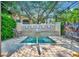 Community hot tub with pergola and lush landscaping at 4126 Central Sarasota Pkwy # 2026, Sarasota, FL 34238