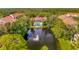 Aerial view of community with lake and pool at 4126 Central Sarasota Pkwy # 2026, Sarasota, FL 34238