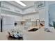 White kitchen with stainless steel appliances and a large sink at 4126 Central Sarasota Pkwy # 2026, Sarasota, FL 34238