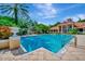 Community pool with surrounding patio and lounge chairs at 4126 Central Sarasota Pkwy # 2026, Sarasota, FL 34238