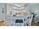 Kitchen with white cabinets, breakfast bar, and stainless steel appliances at 4126 Central Sarasota Pkwy # 2026, Sarasota, FL 34238