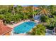 Community pool with spa and lush landscaping at 4126 Central Sarasota Pkwy # 2026, Sarasota, FL 34238