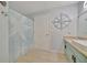 Bathroom with starfish shower curtain, vanity, and compass wall decor at 4126 Central Sarasota Pkwy # 2026, Sarasota, FL 34238