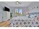 Bedroom with king-size bed, white dresser, and plenty of natural light at 4126 Central Sarasota Pkwy # 2026, Sarasota, FL 34238