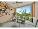 Relaxing screened balcony with seating area and lovely view at 4126 Central Sarasota Pkwy # 2026, Sarasota, FL 34238