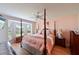Main bedroom with post bed, plenty of natural light and a bay window at 6904 Drewrys Blf # 803, Bradenton, FL 34203