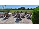 Patio with fire pit and chairs overlooking the golf course at 6904 Drewrys Blf # 803, Bradenton, FL 34203