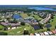 Aerial view showing community features including a golf course and lake at 6904 Drewrys Blf # 803, Bradenton, FL 34203