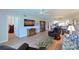 Spacious living room with hardwood floors, open layout, and comfortable seating at 6904 Drewrys Blf # 803, Bradenton, FL 34203