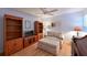 Bright office with hardwood floors, built-in shelving, and a comfortable armchair at 6904 Drewrys Blf # 803, Bradenton, FL 34203