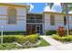 White building exterior with landscaping and walkway at 6904 Drewrys Blf # 803, Bradenton, FL 34203