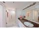 Clean bathroom with granite vanity, a walk-in shower, and tiled floors at 6904 Drewrys Blf # 803, Bradenton, FL 34203