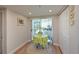Charming breakfast nook with yellow table and chairs, near sliding glass doors at 6904 Drewrys Blf # 803, Bradenton, FL 34203
