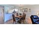 Cozy dining area with a wooden table and chairs near kitchen and living room at 6904 Drewrys Blf # 803, Bradenton, FL 34203
