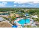 Aerial view of community pool, tennis courts, and clubhouse at 11492 Dancing River Dr, Venice, FL 34292