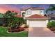 Beautiful two-story house with a well-manicured lawn at 11492 Dancing River Dr, Venice, FL 34292