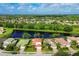 Aerial view of a house and neighborhood, showcasing the property's location and surrounding area at 11492 Dancing River Dr, Venice, FL 34292