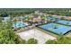 Aerial view of community amenities including pool and tennis courts at 11492 Dancing River Dr, Venice, FL 34292