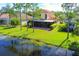 Aerial view of house and backyard with water view at 11492 Dancing River Dr, Venice, FL 34292