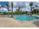 Resort-style pool with lounge chairs and palm trees at 11492 Dancing River Dr, Venice, FL 34292