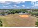 Large recreational field with baseball diamond, soccer field, and playground at 11492 Dancing River Dr, Venice, FL 34292