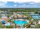 Aerial view of community pool and surrounding landscape at 11492 Dancing River Dr, Venice, FL 34292