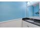 Small bathroom with dark countertop and white cabinets at 5234 Castello Ln, Lakewood Ranch, FL 34211