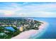 Aerial view of beachfront condo and coastline at 20 Whispering Sands Dr # 501, Sarasota, FL 34242