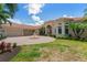 Grand home exterior with circular driveway and fountain at 3218 Signet Ct, Sarasota, FL 34240