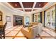 Spacious Gathering room with built-in entertainment center and access to patio at 3218 Signet Ct, Sarasota, FL 34240