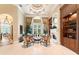 Bright sitting room with fireplace and built-in shelves at 3218 Signet Ct, Sarasota, FL 34240
