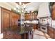 Island kitchen with professional-grade appliances and custom cabinetry at 3218 Signet Ct, Sarasota, FL 34240