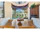 Breakfast nook with view of pool and outdoor living space at 3218 Signet Ct, Sarasota, FL 34240
