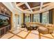 Spacious Gathering room featuring a large sectional sofa and built-in entertainment center at 3218 Signet Ct, Sarasota, FL 34240