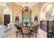 Formal dining room with a large table and chandelier at 3218 Signet Ct, Sarasota, FL 34240