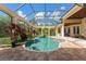 Inviting pool with spa, surrounded by lush landscaping at 3218 Signet Ct, Sarasota, FL 34240