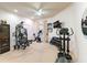 Home gym featuring various exercise equipment and wine storage at 3218 Signet Ct, Sarasota, FL 34240