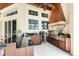 Outdoor kitchen features granite counters, built-in grill, and ample cabinetry at 3218 Signet Ct, Sarasota, FL 34240