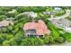 Home's back elevation with pool and lush surroundings at 3218 Signet Ct, Sarasota, FL 34240