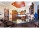 Kitchen with breakfast bar and dark granite countertops at 3218 Signet Ct, Sarasota, FL 34240