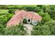 Luxury home with red tile roof, pool, and expansive lot at 3218 Signet Ct, Sarasota, FL 34240