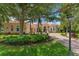 House exterior showcasing lush landscaping and brick driveway at 3218 Signet Ct, Sarasota, FL 34240