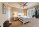 Cozy bedroom with a queen-size bed, nightstands, and ceiling fan at 3218 Signet Ct, Sarasota, FL 34240