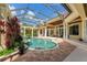 Enclosed pool and spa with a covered patio area at 3218 Signet Ct, Sarasota, FL 34240