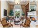 Elegant living room with fireplace and access to backyard patio at 3218 Signet Ct, Sarasota, FL 34240